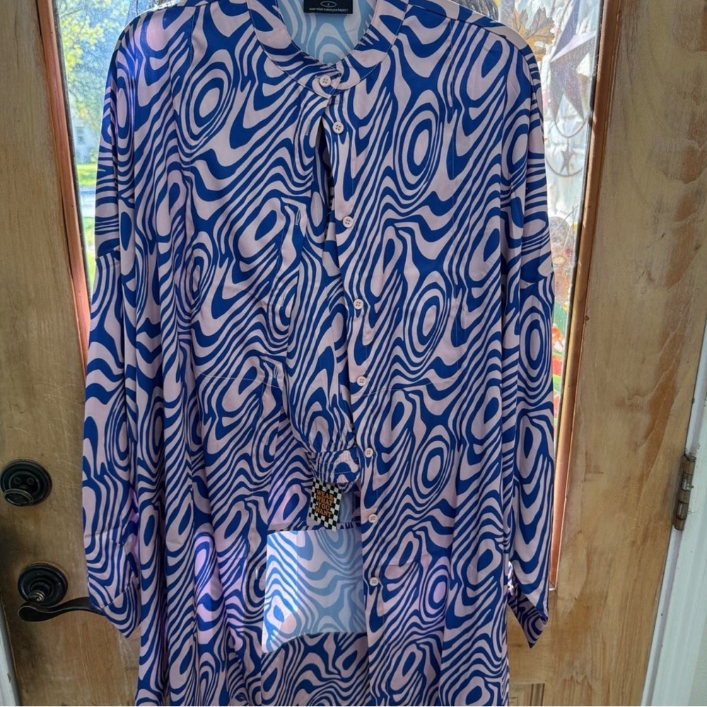 Dressed in Lala satin playsuit in magic swirl